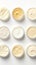 Variety of organic cosmetic creams for skin care in open jars on white background. Top view. Concept of skincare variety