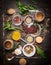 Variety of oriental herbs and spices: Acetic tree, curry powder, paprika, cayan pepper, sira,Bay leaf on spoons and bowls, top vie