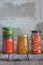 Variety of preserved food in glass jars - pickles, jam, marmalade, sauces, ketchup. Preserving vegetables and fruits. Fermented fo