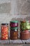 Variety of preserved food in glass jars - pickles, jam, marmalade, sauces, ketchup. Preserving vegetables and fruits. Fermented fo