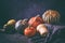 Variety of pumpkins - autumn agricultural still life with cucurbita fruits come in an assortment of colors and sizes, closeup