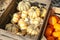 variety of pumpkins in wooden boxes are sold at the market on Thanksgiving Eve