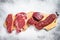 Variety of raw black angus beef meat steaks fillet Mignon, rib eye or cowboy, Striploin or new york, skirt or machete. White