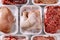 Variety of raw meat in foam packaging trays