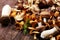 Variety of raw mushrooms on wooden table. oyster and other fresh