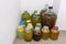 Variety of refreshing barley drink kvass in glass jars and bottles in cold basement of the house