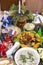 A variety of salads, snacks and meat dishes on the New Year`s table