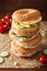 Variety of sandwiches on bagels: egg, avocado, ham, tomato, soft