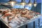 Variety of sea fishes on the counter in a greek fish shop.