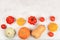 A variety of selection pumpkins, squash and tomatoes on a gray table. Autumn composition with gifts of nature, thanksgiving day