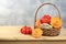 A variety of selection pumpkins, squash and tomatoes on a wooden table. Autumn composition with gifts of nature, thanksgiving day