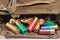 Variety of shotgun ammunition, spilling out of pouch