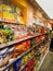 Variety of snacks and potato chips on a supermarket shelf