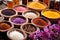 variety of soap crafting additives: dried flowers, spices, and cocoa beans