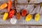 Variety of spices and herbs garlic and colorful whole peppers on old wooden kitchen table