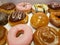 variety of sweet bread doughnuts with chocolate and caramel for breakfast or snack