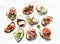 Variety of tapas sandwiches  - sandwiches with prosciutto, avocado, salmon, egg, tomatoes, jamon, gorgonzola, brie, pear on a