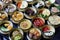 Variety of tasty Asian dishes top view packed on table