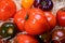 Variety of tasty ripe french tomatoes in wooden boxes on farmers market in Provence in summer