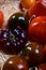 Variety of tasty ripe french tomatoes in wooden boxes on farmers market in Provence in summer