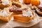 Variety of Thanksgiving pie slices on parchment paper