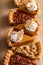 Variety of Thanksgiving pie slices on parchment paper