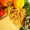 Variety of uncooced italian pasta on wooden table