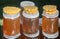 A variety of varieties of honey in jars offered for sale at the