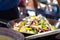 A variety of vegetables on frying pan at the Bergen fishmarket