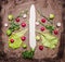 A variety of vegetables, laid out in the form of Christmas and New Year tree, radish, daikon, lettuce, Brussels sprouts on wooden