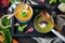 Variety of vegetarian soups cream of carrot and broccoli cabbage on a dark concrete background. Selective focus. Top view. Copy