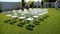 Variety of white folding chairs in the reception area of the marriage on the wedding ceremony.