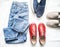 Variety of women`s fashion free walking style clothing and shoes - moms jeans, slipons, espadrilles, leather shoes on a light