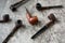 Variety of Wooden Smoke Pipes on a Gray Background