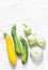 Variety zucchini, squash on a light background, top view. Vegetarian diet food concept.