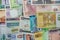 Various African banknotes stacked on top of each other forming a money background.