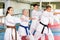 Various aged men and women training kata moves