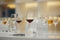 Various alcoholic beverages in glasses in white table in wine room. Sommelier school, professional certification