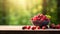 Various berries in a bowl against the backdrop of the garden. Selective focus.