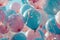 various blue and pink balloons are seen in the air,