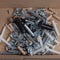 Various bolts, screws, wooden dowels, fasteners for assembling wooden furniture