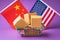 Various boxes in a food basket and flags of China and America on a colored background, the concept of trade between countries