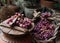 Various bunches of red grapes on wicker basket