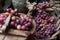 Various bunches of red grapes on wicker basket