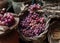 Various bunches of red grapes on wicker basket