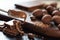 Various candies, chocolate and spoon with cocoa paste on a dark wooden surface