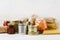 Various canned food and raw cereal grains on a table