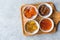 Various Ceramic bowl of Fruit jams Fig, Quince, Bergamot Citrus, Watermelon in wooden tray / Marmalade.