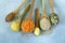 Various cereals in wooden spoons