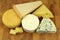 Various cheeses on a kitchen board